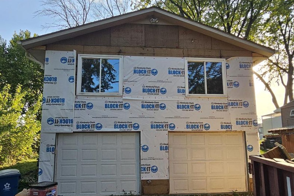 Before: house wrapped after tear-off