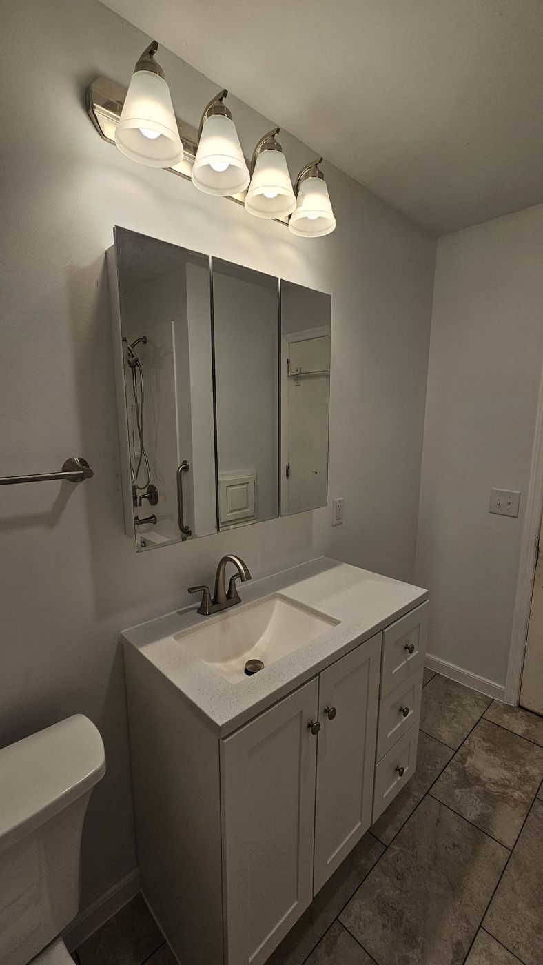 New vanity, lighting and tile