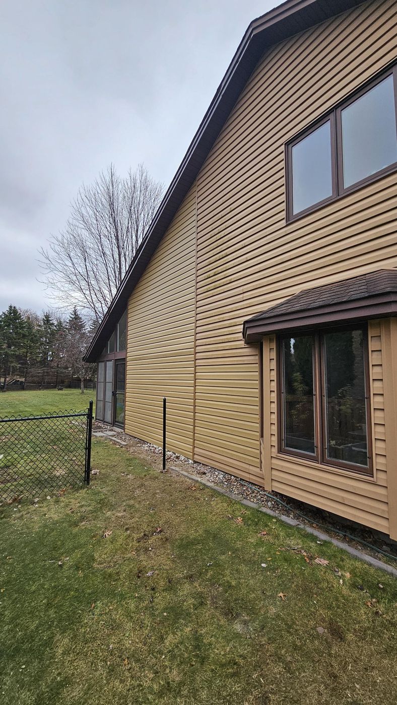 After: seamless siding, no sign of the old chimney