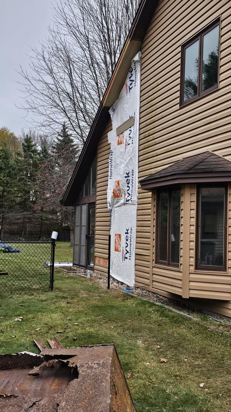 New sheathing and house wrap where the chimney was