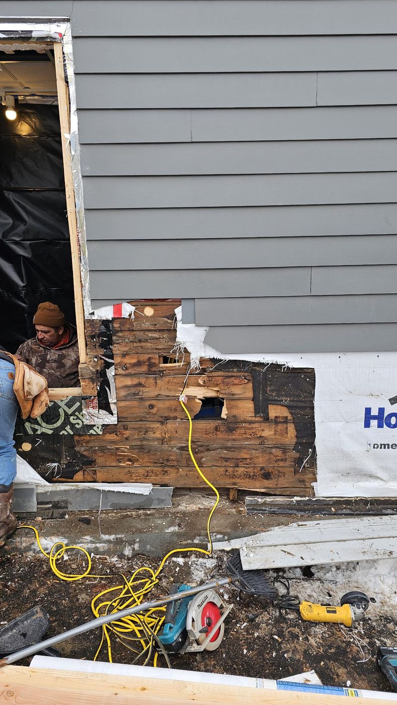 Rotted sheathing found behind the old siding and replaced