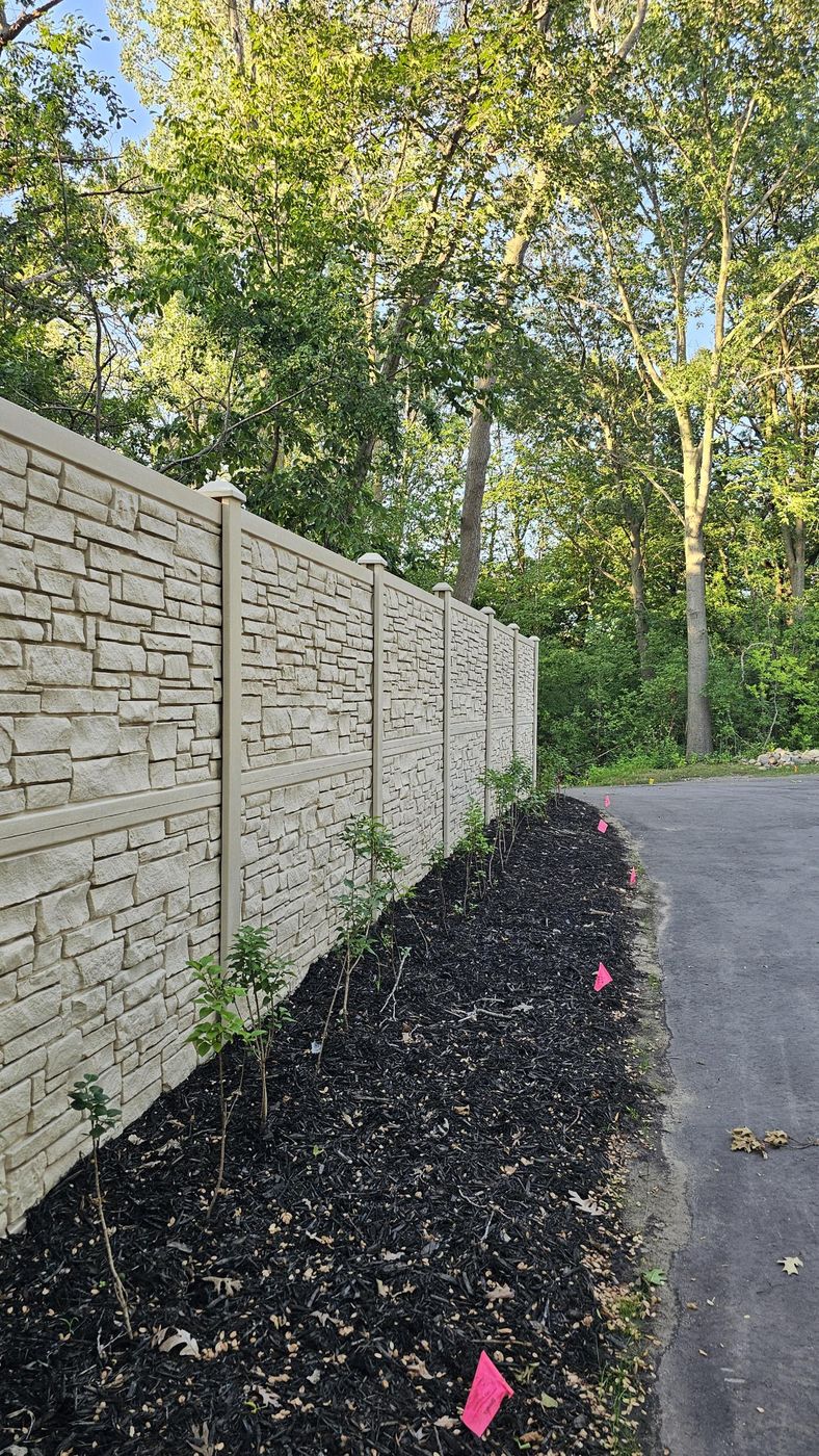 Fence line along the driveway, planted and mulched