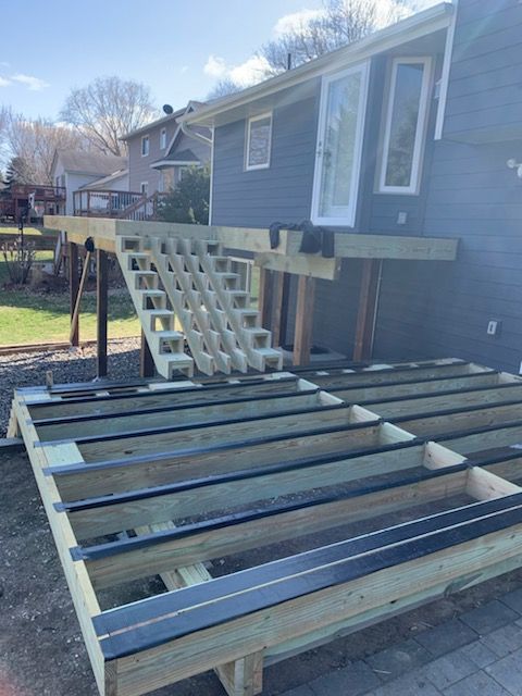 Pressure-treated frame with joist tape, stair stringers cut