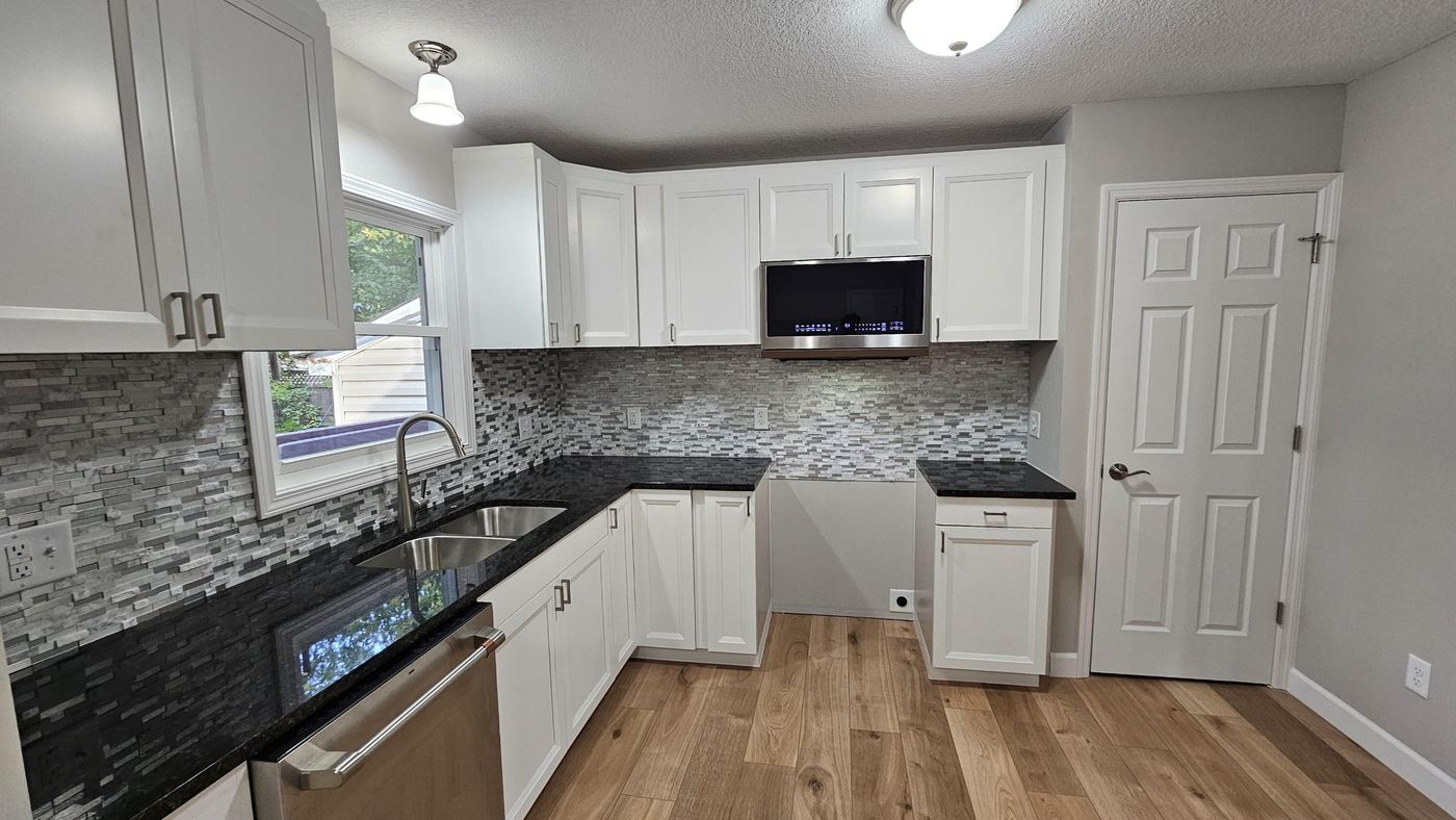 Finished kitchen: granite, tile backsplash, new cabinets